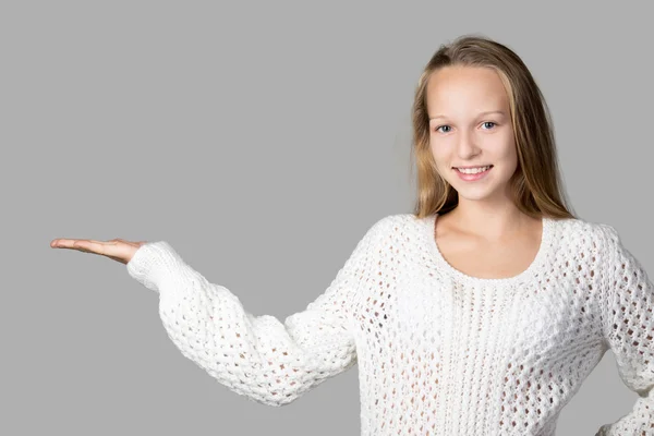 Girl demonstrating something on copyspace — Stockfoto