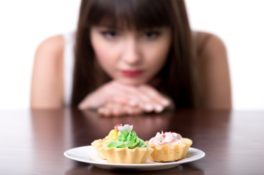 Dieting woman craving for cake clipart
