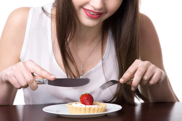 Young woman eating cake — Stock Photo, Image