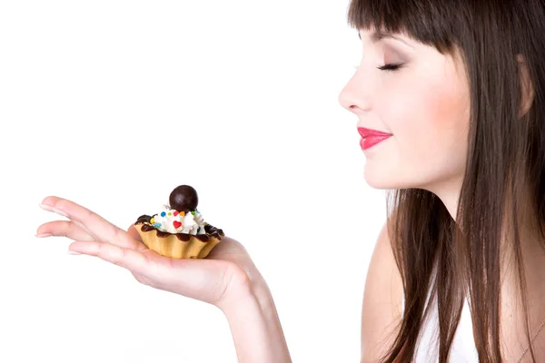 Young woman enjoying smell of the cake — Stock Photo, Image