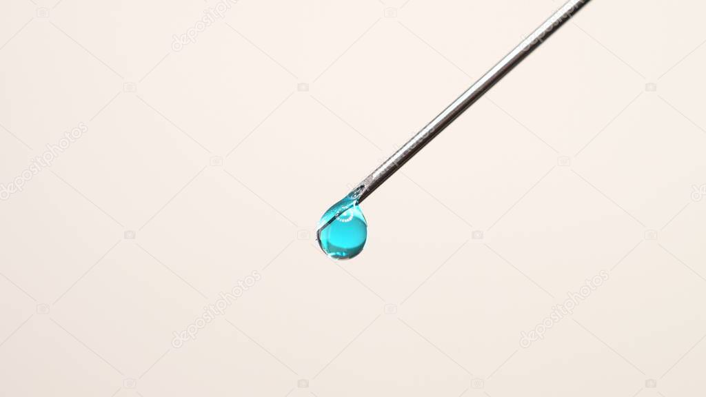 Vaccine dripping from sterile needle syringe. Concept of medical research development and production of vaccine against coronavirus, COVID 19. Drugs and medications for pharmaceutical industry. 