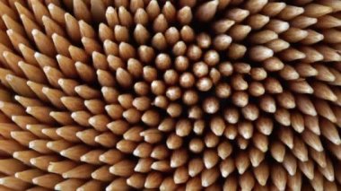 Soyut kürdan rotasyonuna aşırı yakın çekim. Kokteyl çubukları ya da kürdan makro odak noktası. Diş hijyeni ya da diş bakımı kavramı. Kariyer önleme. Diş Sağlığı Hizmetleri.