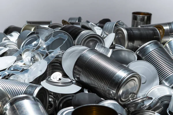 Recycle empty cans and tin. Aluminum soda cans and food jars. Sorted metal trash and garbage ready for recycling. Steel rubbish. Concept of environmental catastrophic apocalypse garbage pollution.