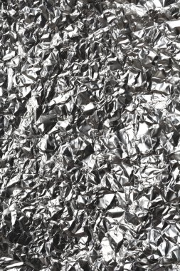 Silver wrinkled and shrunken foil surface