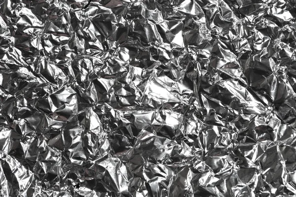 Silver wrinkled and shrunken foil — Stok fotoğraf