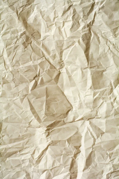 Zmačkaný papír textury. Žlutá balicího papíru list. Deformační a — Stock fotografie