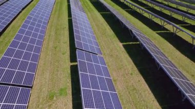 Solar panels aerial view. Modern photovoltaic electricity system created electric power generation without deforestation and environment impact. Green energy and Climate change concept.