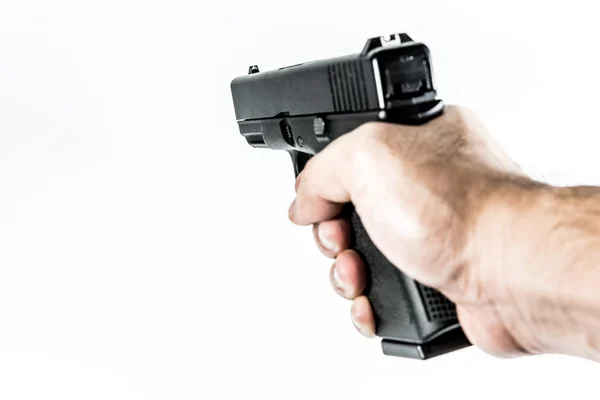 Skjutvapen pistol i handen — Stockfoto