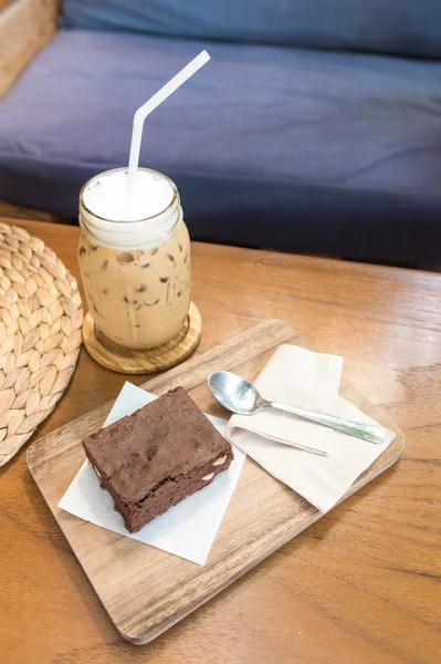 Delicious ice coffee and  Chocolate Brownie on wooden tray — Stock Photo, Image