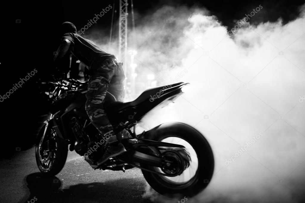 black and white  motion blur of  motorcycle  stunt rider riding 