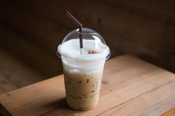 Ice coffee in plastic glass — Stock Photo, Image