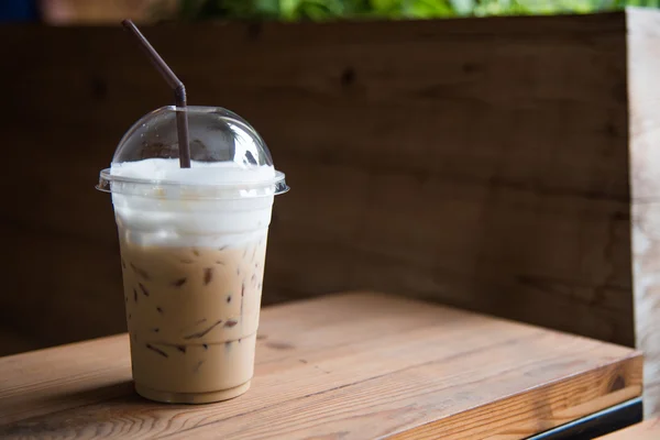 Ice coffee in plastic glass — Stock Photo, Image