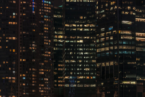 Close up high modern building illuminated at night