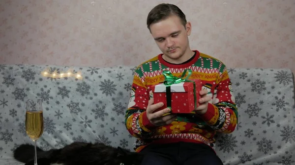 New Years Holidays Young Guy Opens Wraps Gift Champagne New — Stock Photo, Image