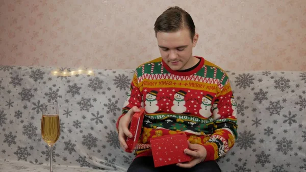 New Year Holidays Young Guy Opens Wraps Gift Champagne New — Stock Photo, Image