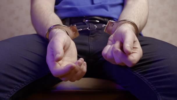 Young Guy Sits Chair Handcuffs His Back Tries Take Them — Stock Video