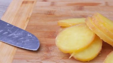 Boiled potatoes, cutting and preparing potatoes for kneading into Olivier salad, the concept of preparing a salad, food from the restaurant