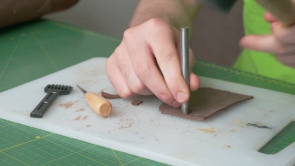 Young Leather Craftsman Working Home Craftsman Punching Holes Leather Leather — Stock Video