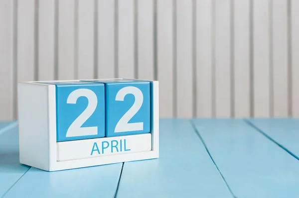 April 22nd. Earth Day. Image of april 22 wooden color calendar on white background.  Spring day, empty space for text