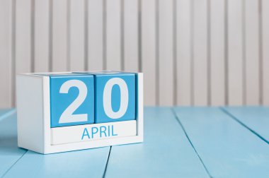 April 20th. Cannabis Day. Image of april 20 wooden color calendar on white background.  Spring day, empty space for text.  Secretarys DAY