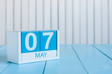May 7th. Image of may 7 wooden color calendar on white background.  Spring day, empty space for text