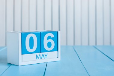 May 6th. Image of may 6 wooden color calendar on white background.  Spring day, empty space for text
