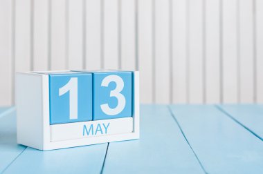 May 13th. Image of may 13 wooden color calendar on white background.  Spring day, empty space for text
