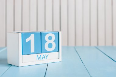 May 18th. Image of may 18 wooden color calendar on white background.  Spring day, empty space for text.  International Museum Day