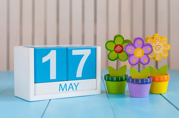 May 17th. Image of may 17 wooden color calendar on white background with flowers. Spring day, empty space for text.  International Day Against Homophobia, IDAHOBIT — Stock Fotó
