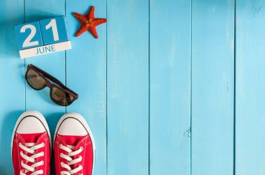 June 21st. Image of june 21 wooden color calendar on blue background. Summer day. Empty space for text. Go Skateboarding Day