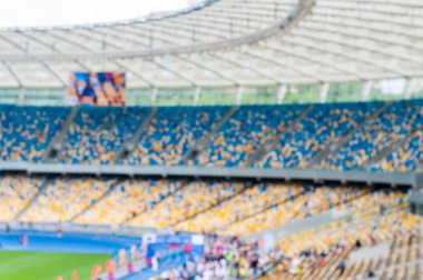 Bulanık büyük futbol arena veya stadyum standları ve seyirci ile. 2016 spor arka plan