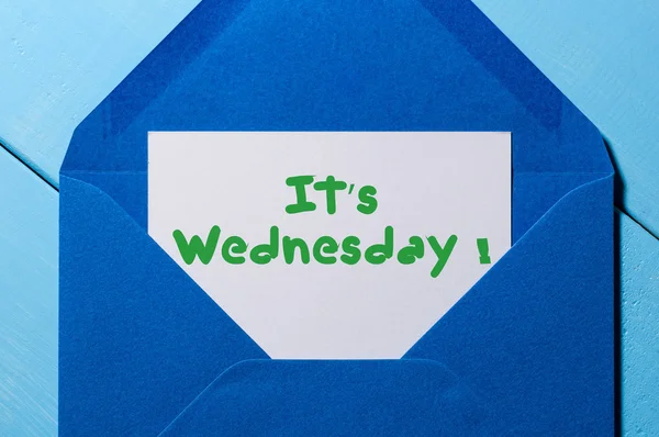 Its Wednesday on sheet of paper in blue envelope. Happy week concept — Stock Photo, Image