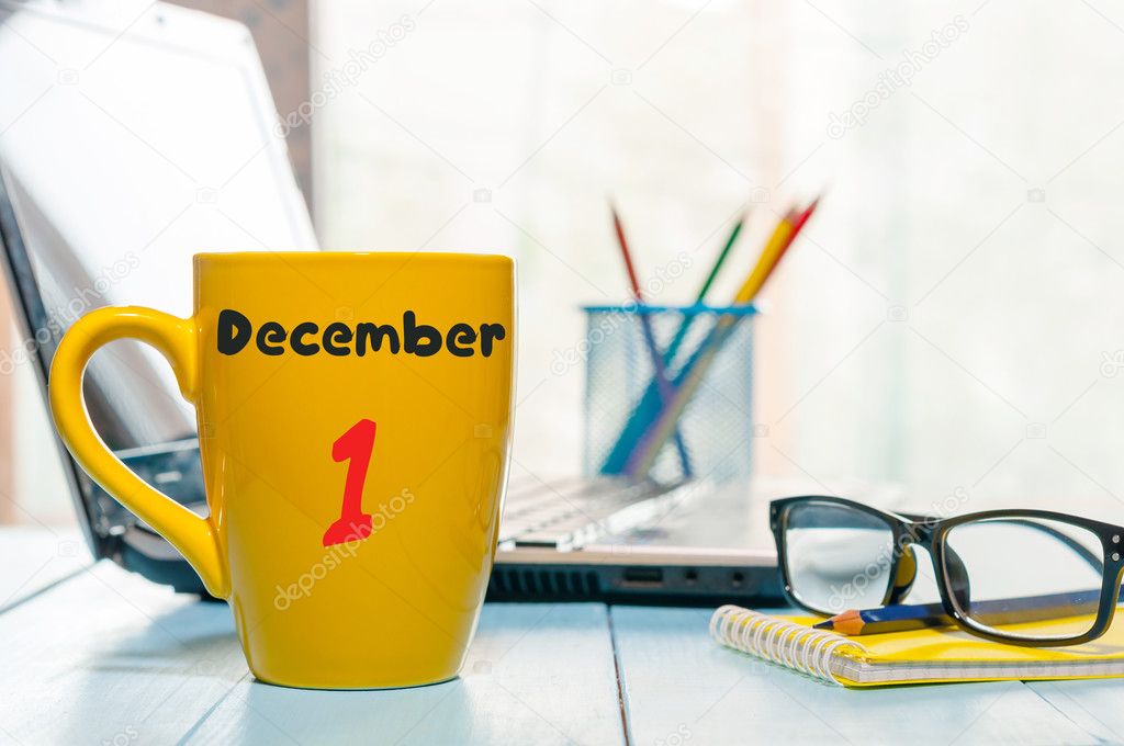 December 1st. Day 1 of month, Calendar on cup morning coffee or tea, teacher workplace background. Winter time. Empty space for text