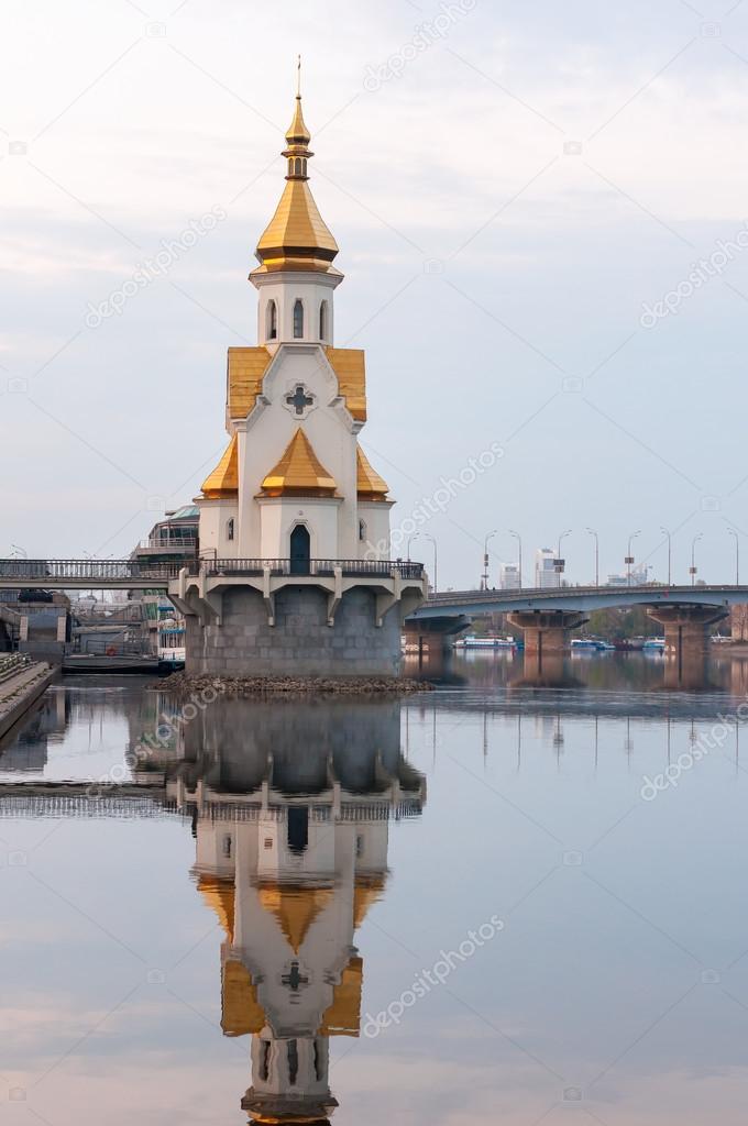 Capital of Ukraine - Kyiv. Church Saint Nicholas on the water, old embankment and Havanskyi Bridge