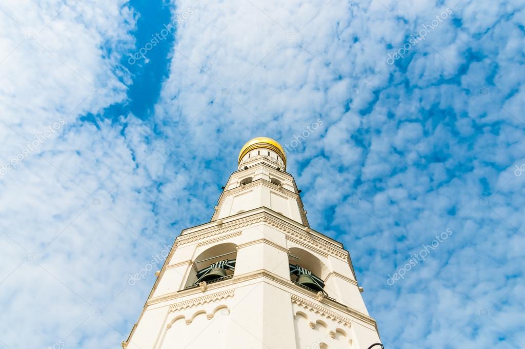 Ivan the Great Bell Tower and Assumption belfry in Moscow Kremlin over blue sky, Red Square