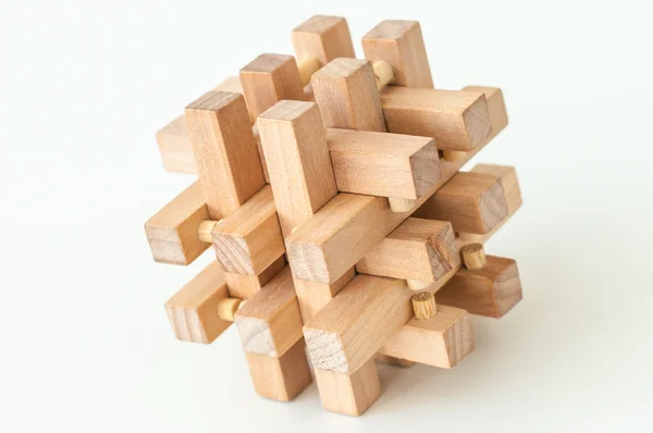 Houten brain teaser op witte achtergrond — Stockfoto