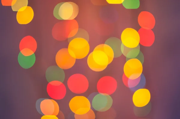 Červené a oranžové holiday bokeh. Abstraktní rozmazané Vánoční pozadí — Stock fotografie