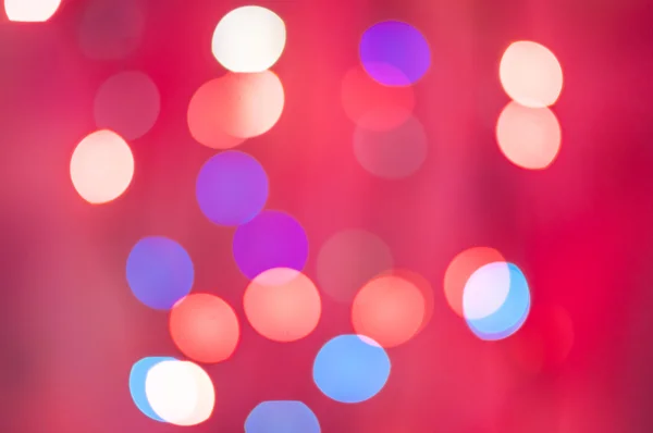 Gyönyörű defocused LED-es lámpák szűrt bokeh elvont rózsaszín krém színű hang háttér. — Stock Fotó