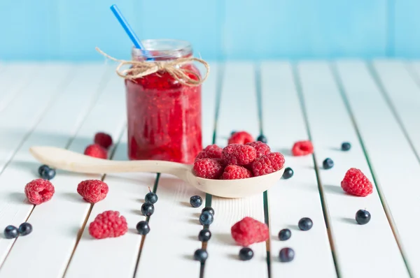 Jars of fruity jams on white background. Preserved fruits — Stockfoto