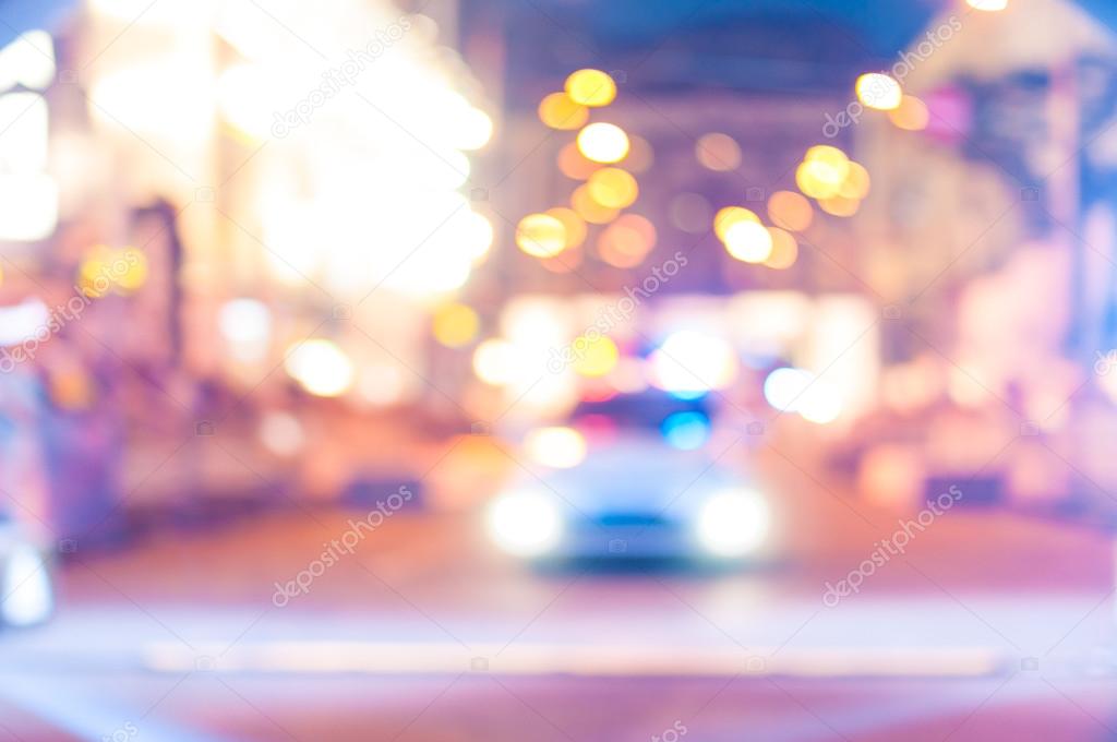 Blurred police car on the street at night