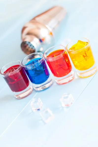 Cocktails - Color soft drinks with ice on light background. Selective focus — Stock Photo, Image