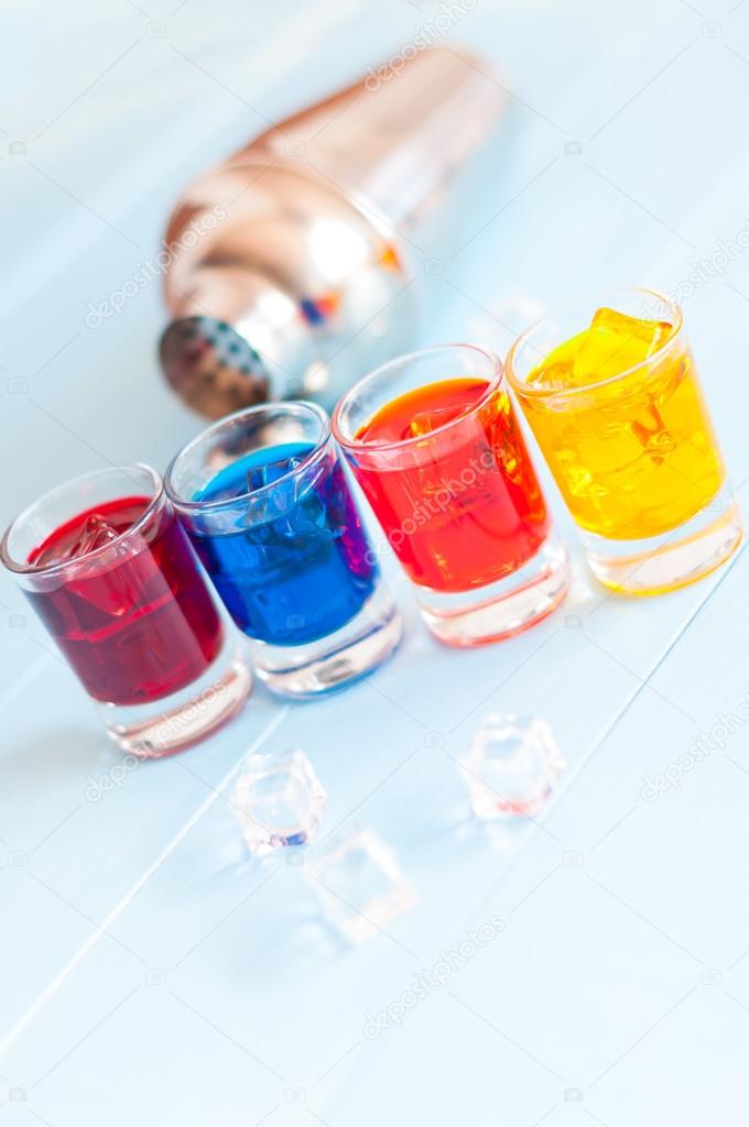 Cocktails - Color soft drinks with ice on light background. Selective focus