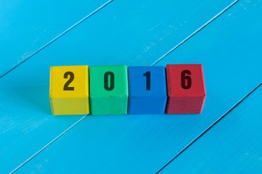 Mutlu yeni yıl 2016. Renkli tasarım. Rakamı çocuk renkli küpler veya bloklar