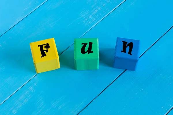 Alphabet building blocks that spelling the word fun — Stock Photo, Image