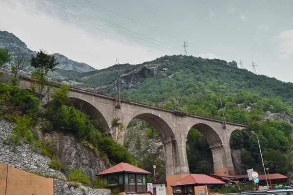 Train bridge infront of huge mountain during overcast weather near neretva river Bosnia and herzegovina. Neretva Bosnia and Herzegovina. 12.08.2018.