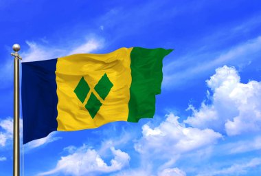 Saint Vincent ve Grenadines Bayrakları Rüzgarda Dalgalanıyor Güzel bir yaz mavi gökyüzünde