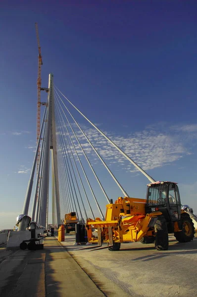 End of shift at the cable bridge construction site, machinery is turned off