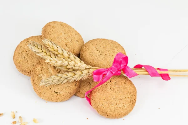 Integrerad cookies och veteplantan på vit baclground — Stockfoto