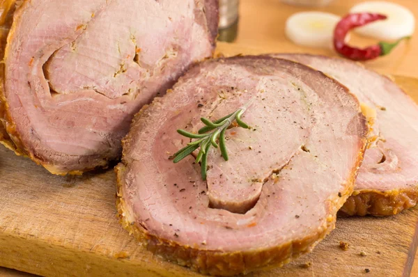 Rolled pork on a cutting board — Stock Photo, Image