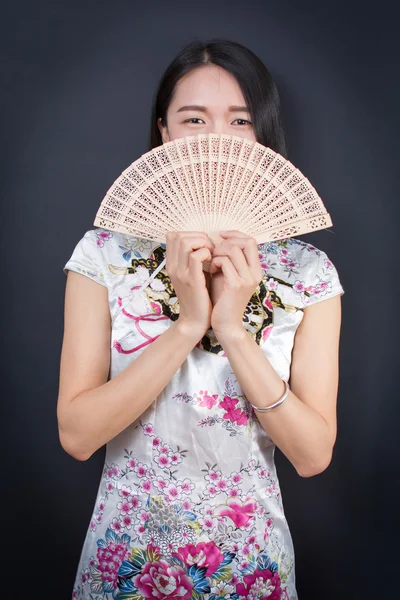 Beautiful Asian woman with a hand fan Royalty Free Stock Images